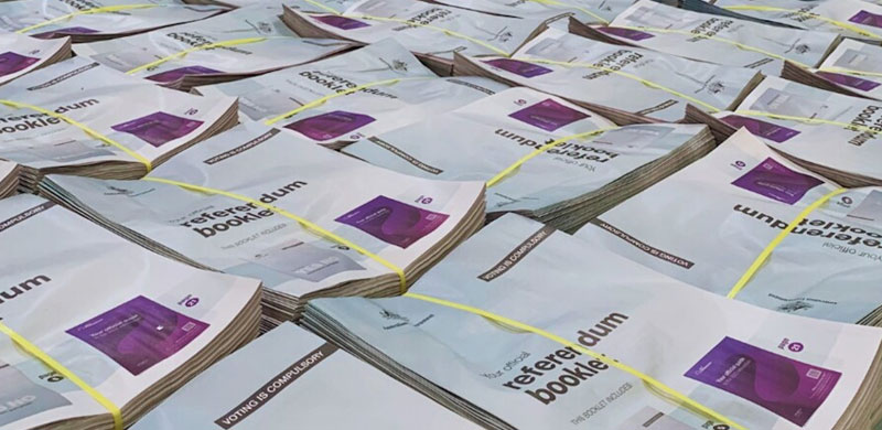 stacked of rererendum booklets ready for distribution